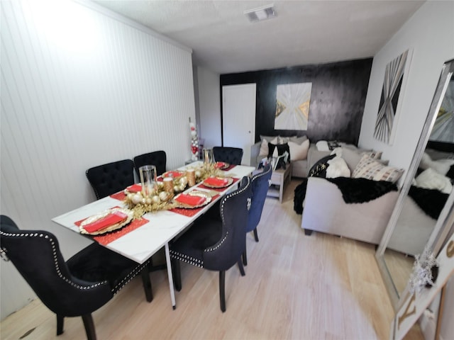 dining space with light wood-type flooring