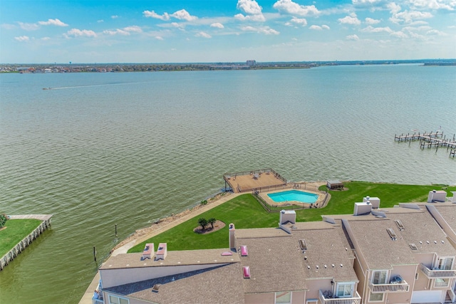 birds eye view of property featuring a water view