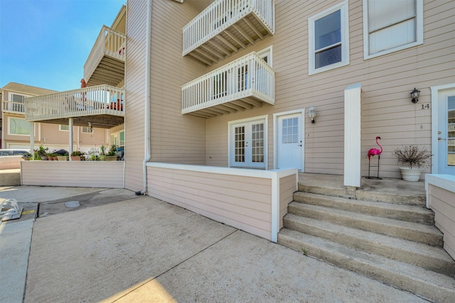 property entrance with a patio area