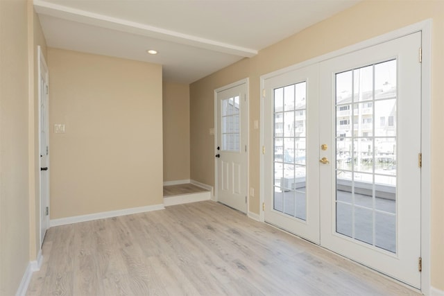 doorway featuring french doors and light hardwood / wood-style flooring