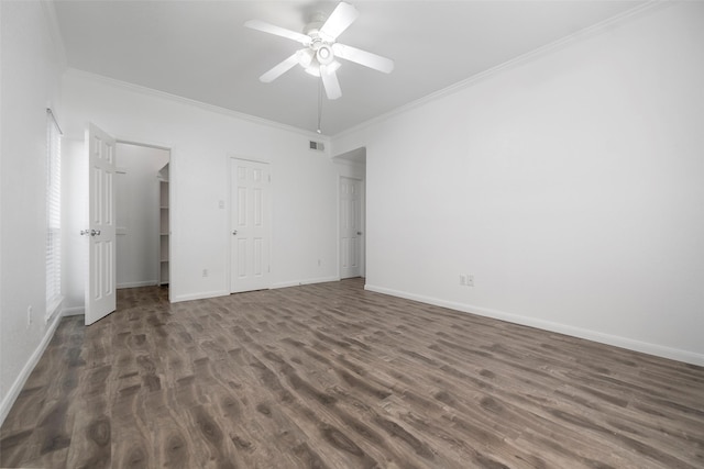 unfurnished bedroom with dark hardwood / wood-style flooring, ceiling fan, and crown molding