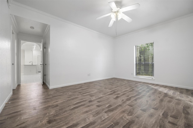 unfurnished room featuring crown molding, ceiling fan, and dark wood-type flooring