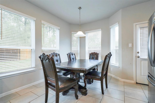 dining space with light tile patterned flooring