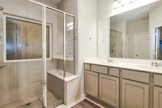 bathroom with vanity and an enclosed shower