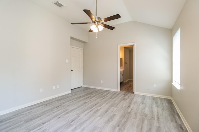 unfurnished room featuring ceiling fan, light wood-type flooring, and vaulted ceiling