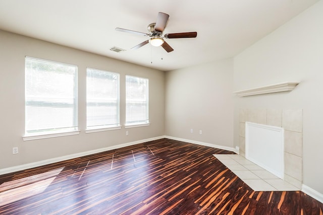 unfurnished living room with light hardwood / wood-style flooring and ceiling fan