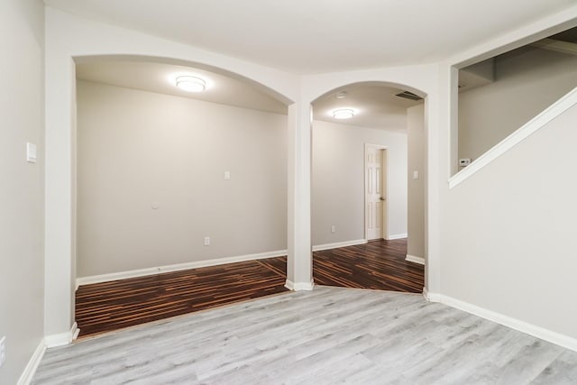 spare room with light hardwood / wood-style flooring