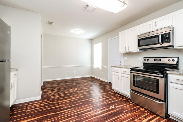 kitchen featuring light stone countertops, appliances with stainless steel finishes, dark hardwood / wood-style floors, and white cabinetry