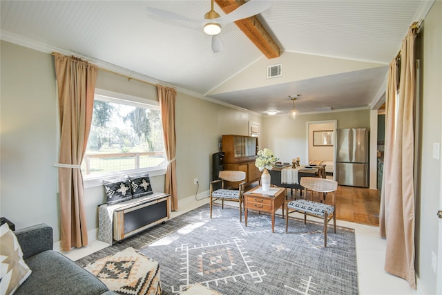 living area featuring ceiling fan, hardwood / wood-style floors, lofted ceiling with beams, and ornamental molding