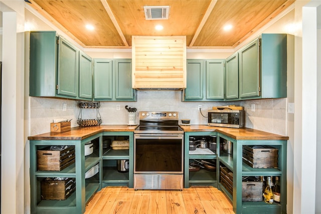 kitchen with appliances with stainless steel finishes, light hardwood / wood-style flooring, green cabinetry, butcher block counters, and range hood