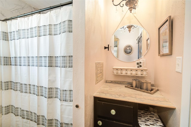 bathroom with vanity and a shower with shower curtain