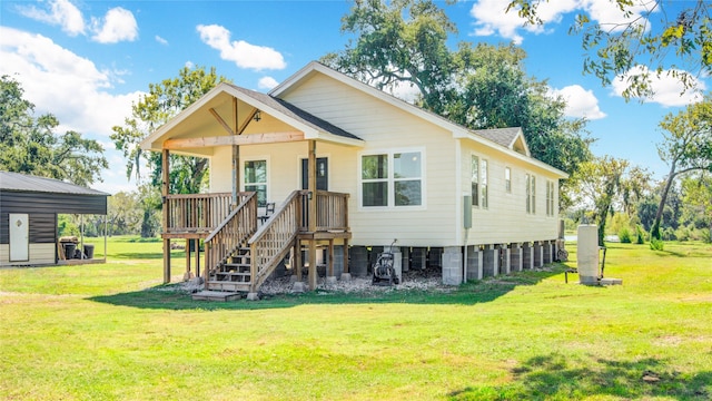 rear view of house with a yard