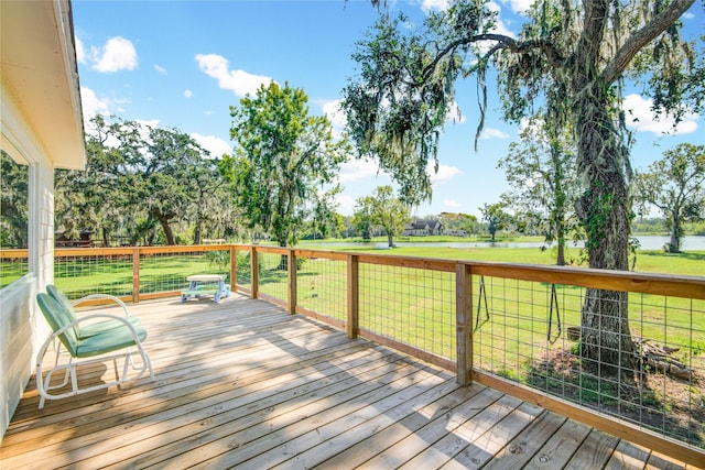 deck featuring a water view and a yard