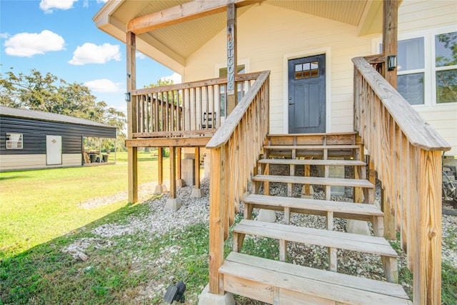 property entrance featuring a lawn