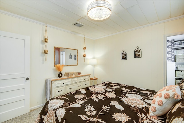 bedroom featuring light colored carpet and crown molding