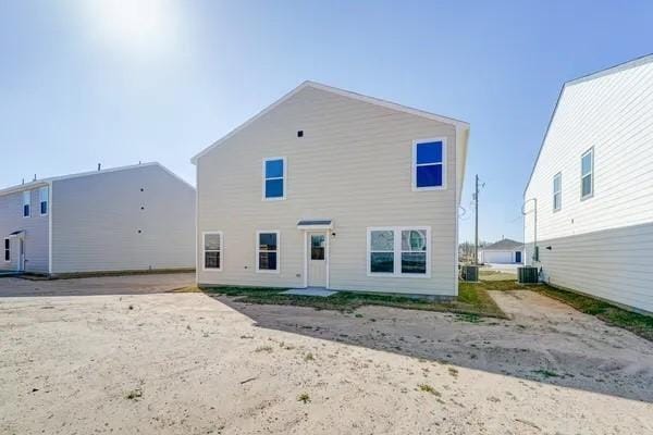 back of property with central AC unit