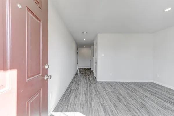 unfurnished room with light wood-type flooring