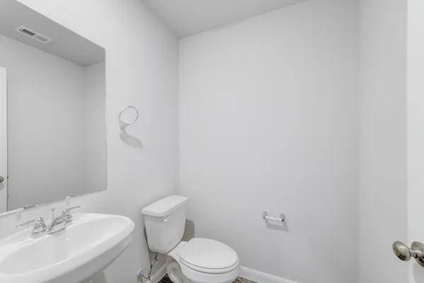 bathroom with toilet and sink