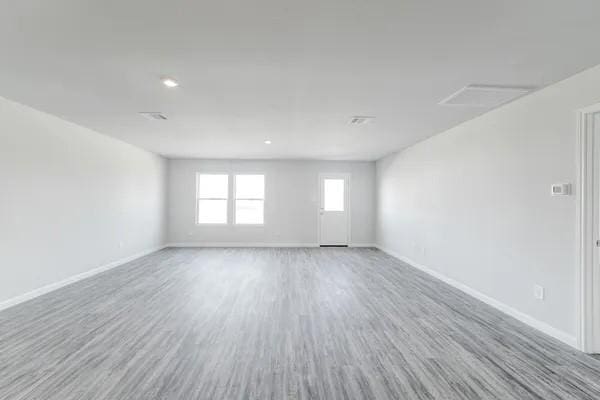 spare room with hardwood / wood-style flooring