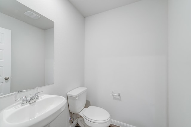 bathroom with sink and toilet