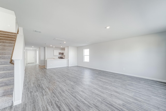 unfurnished living room featuring light hardwood / wood-style flooring