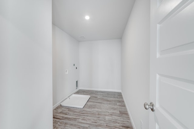 interior space with light wood-type flooring and electric dryer hookup