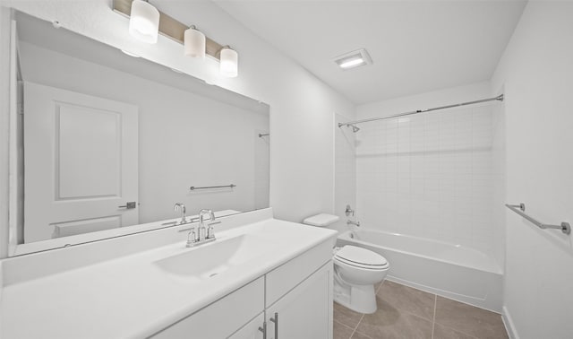 full bathroom with vanity, toilet, tiled shower / bath combo, and tile patterned flooring