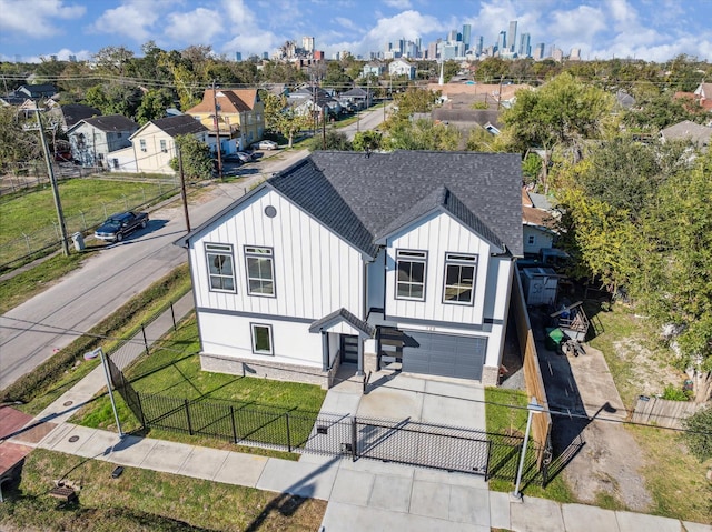 view of front of house with a garage and a front lawn