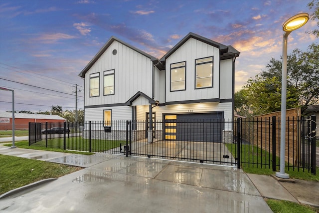 view of front of property with a garage and a lawn