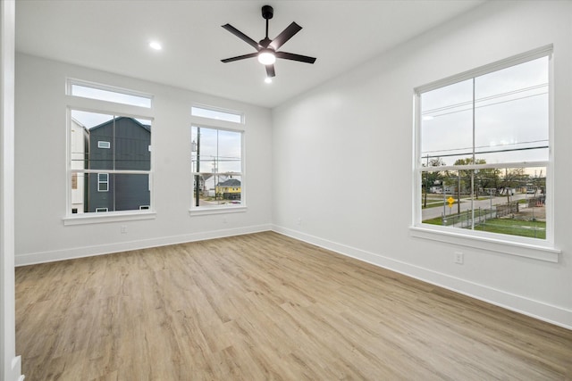 empty room featuring light hardwood / wood-style floors and ceiling fan