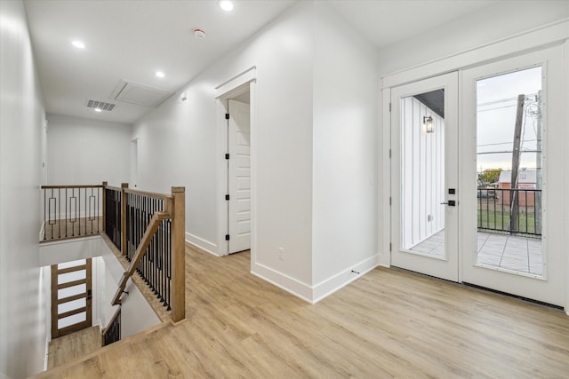 hallway with light wood-type flooring