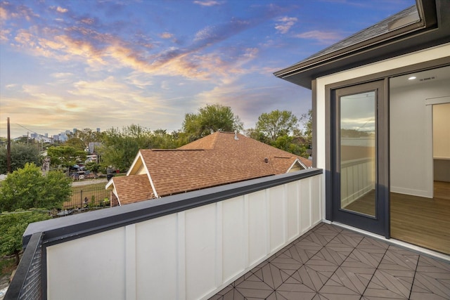 view of balcony at dusk