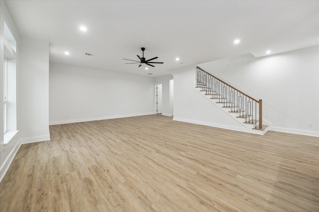 unfurnished living room with light hardwood / wood-style floors and ceiling fan