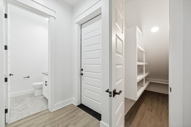 hallway featuring light hardwood / wood-style flooring