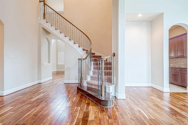 staircase with wood-type flooring