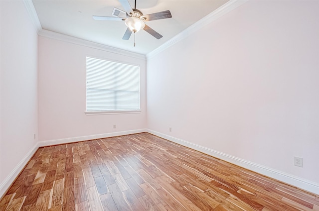 spare room with light hardwood / wood-style flooring, ceiling fan, and crown molding