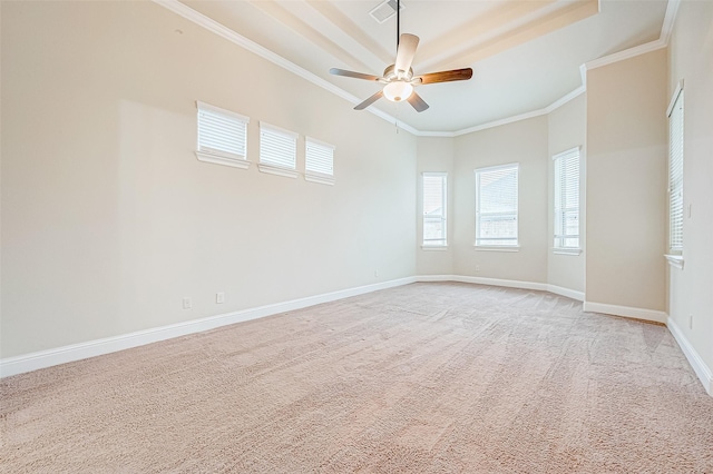 carpeted empty room featuring ceiling fan and ornamental molding