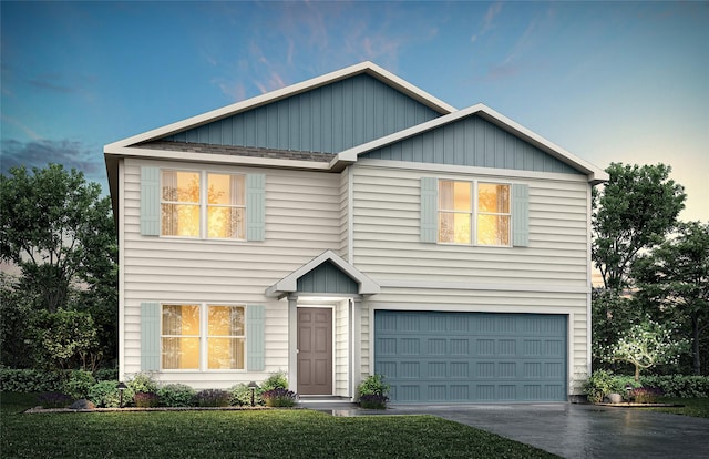 view of front facade featuring a garage and a front lawn