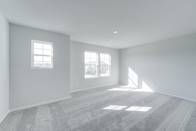 unfurnished room with carpet floors