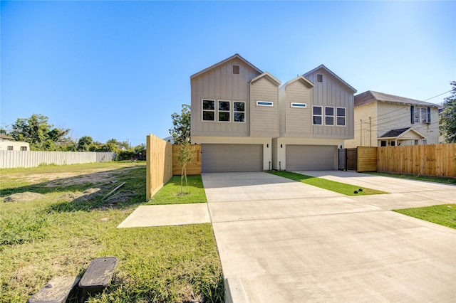 view of front facade featuring a garage and a front lawn