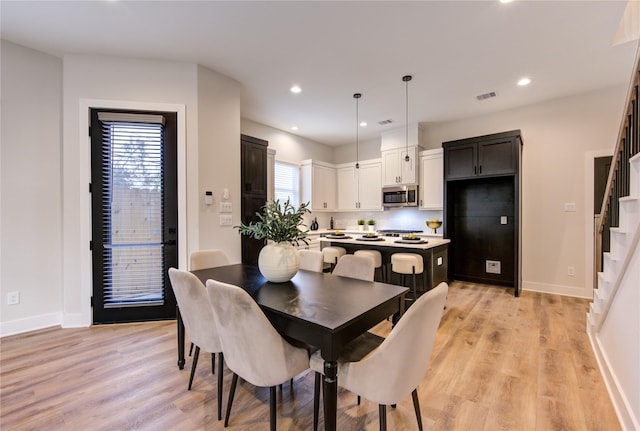 dining room with light hardwood / wood-style floors