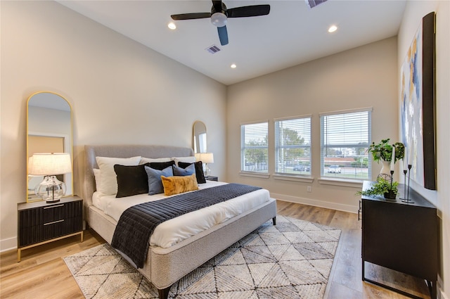 bedroom with ceiling fan and light wood-type flooring