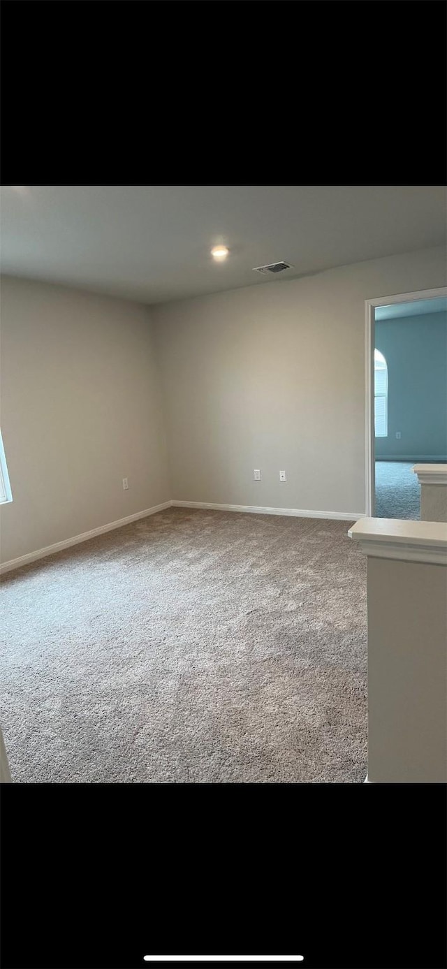 spare room with carpet floors