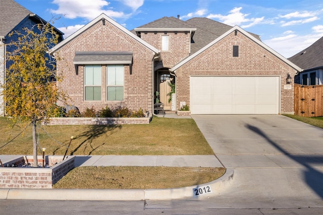 view of front property with a garage and a front lawn