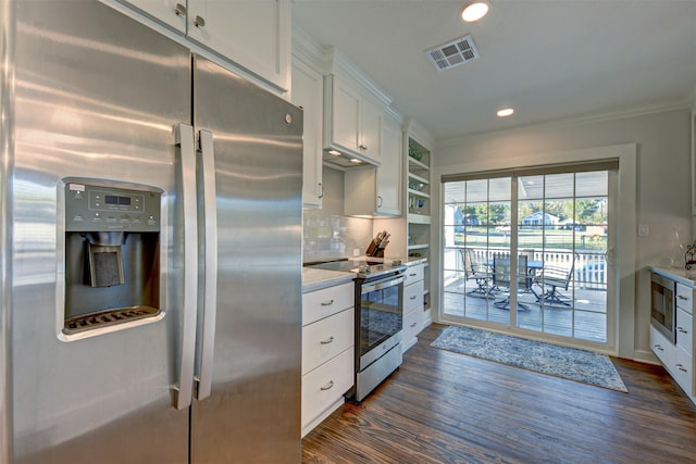 kitchen with white cabinets, crown molding, decorative backsplash, dark hardwood / wood-style flooring, and stainless steel appliances