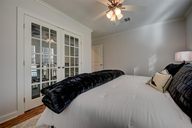 bedroom with ceiling fan, wood-type flooring, crown molding, and french doors