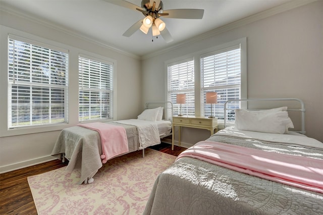 bedroom with ceiling fan, dark hardwood / wood-style flooring, and ornamental molding