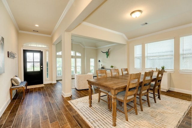 dining room featuring crown molding and dark wood-type flooring