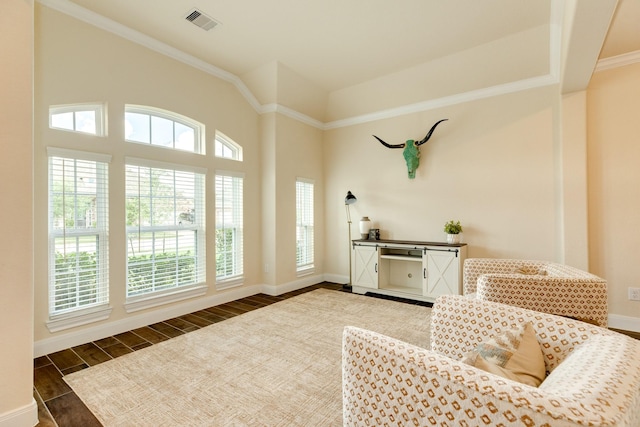 sitting room featuring dark hardwood / wood-style flooring and crown molding