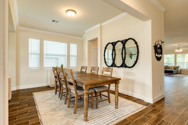 dining space featuring ceiling fan, dark hardwood / wood-style flooring, and ornamental molding